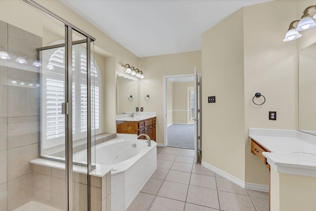 bathroom with vanity, plus walk in shower, and tile patterned flooring