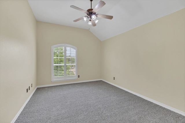 spare room with ceiling fan, carpet floors, and lofted ceiling