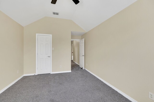 unfurnished bedroom with ceiling fan, lofted ceiling, and light carpet