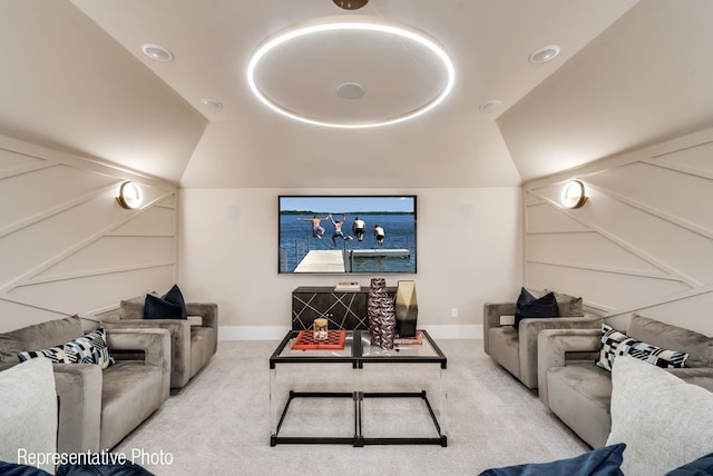 living room featuring a raised ceiling, light colored carpet, and vaulted ceiling