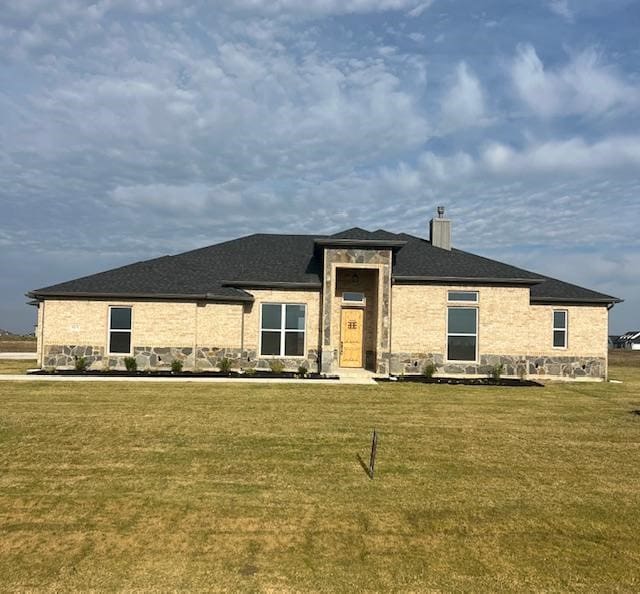 prairie-style house with a front lawn