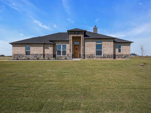 prairie-style house with a front yard