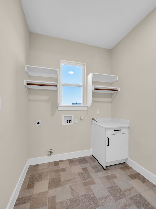 washroom with cabinets, washer hookup, hookup for an electric dryer, and hookup for a gas dryer