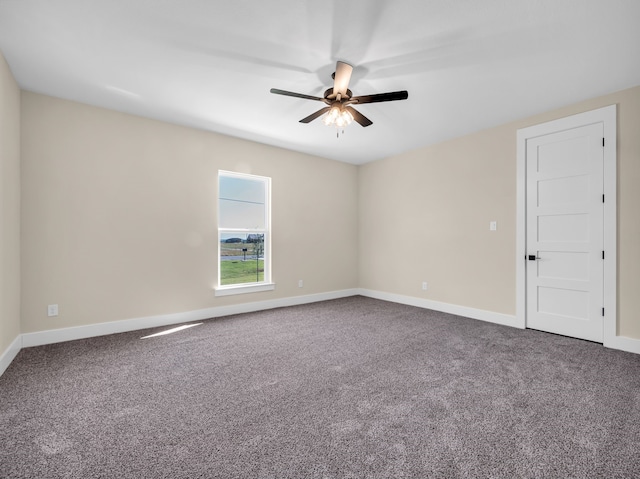 carpeted empty room featuring ceiling fan