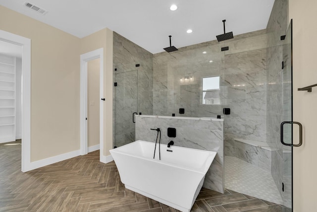 bathroom with shower with separate bathtub and parquet flooring