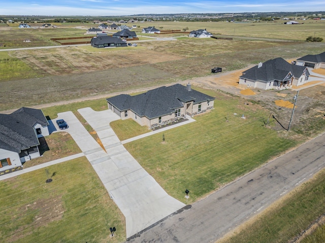 birds eye view of property featuring a rural view