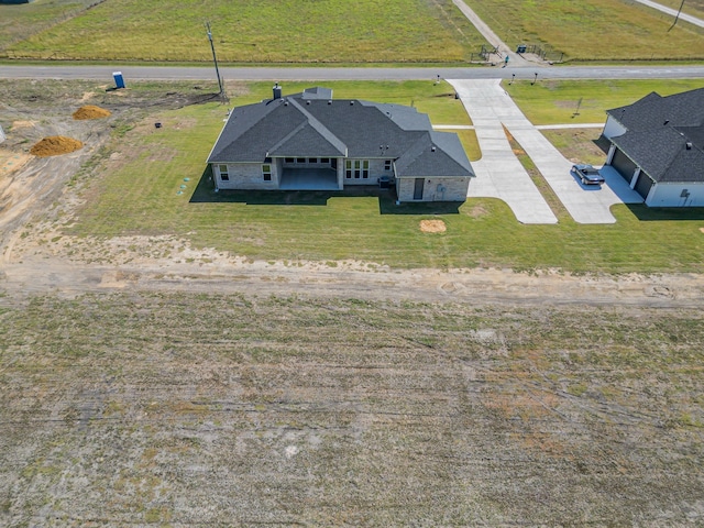 birds eye view of property with a rural view