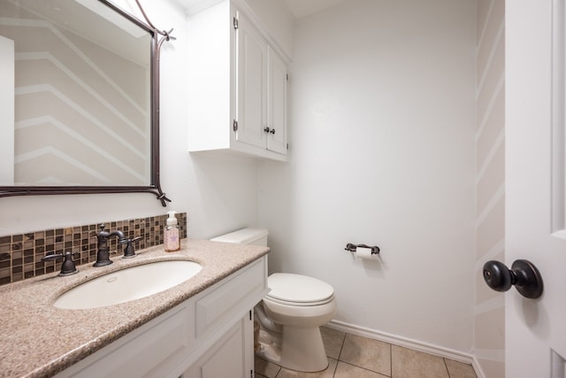 bathroom with tile patterned flooring, decorative backsplash, toilet, and vanity