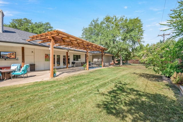 view of yard with a patio area, a pergola, and french doors