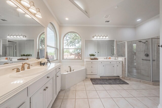 bathroom featuring independent shower and bath, dual vanity, ornamental molding, and tile patterned floors