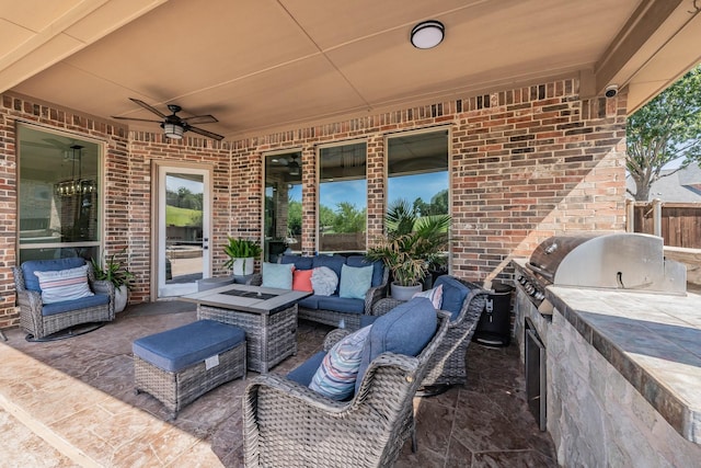 view of patio / terrace with ceiling fan, outdoor lounge area, and exterior kitchen