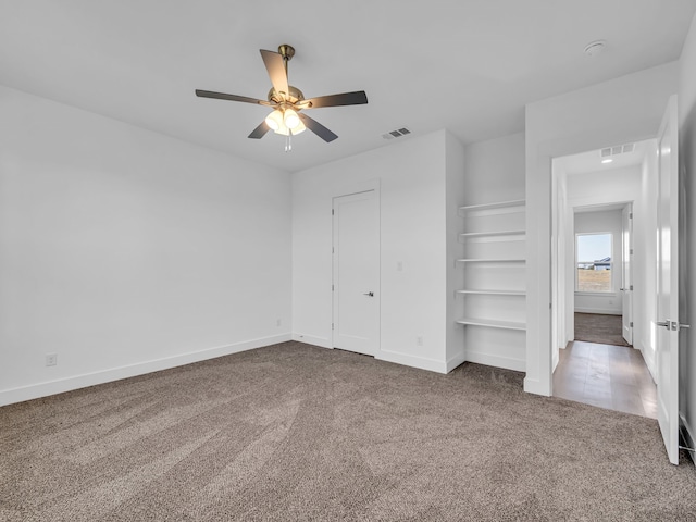 unfurnished bedroom with carpet floors and ceiling fan