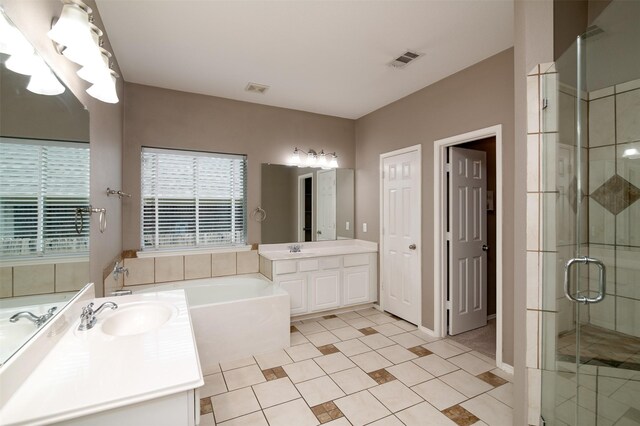 bathroom with vanity, plus walk in shower, and tile patterned flooring