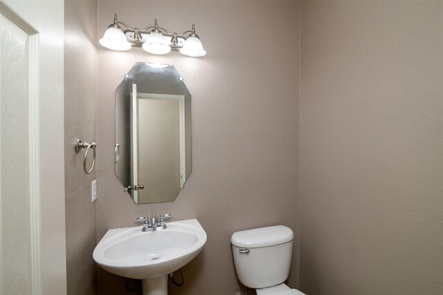 bathroom with sink and toilet