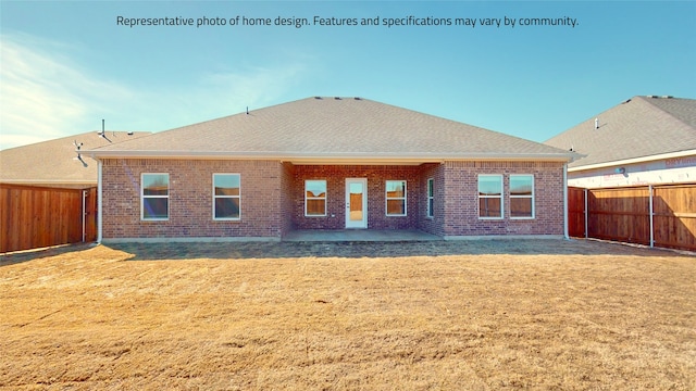 rear view of property featuring a lawn and a patio