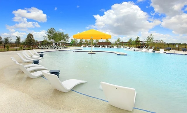 view of swimming pool featuring a patio area