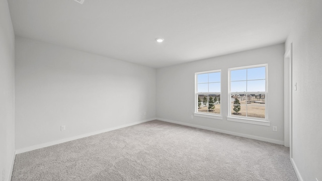 empty room with carpet flooring