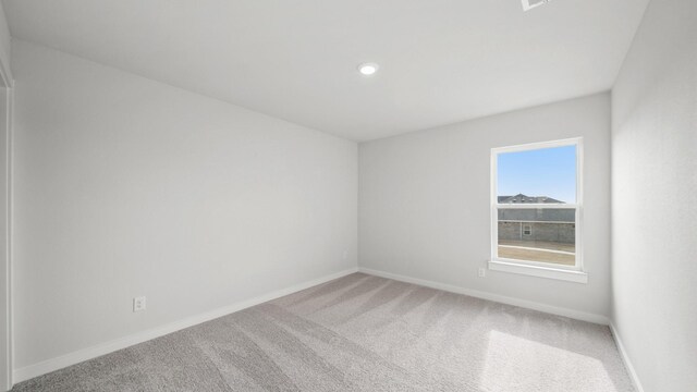 unfurnished room with carpet floors