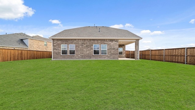 back of property featuring a yard and a patio area