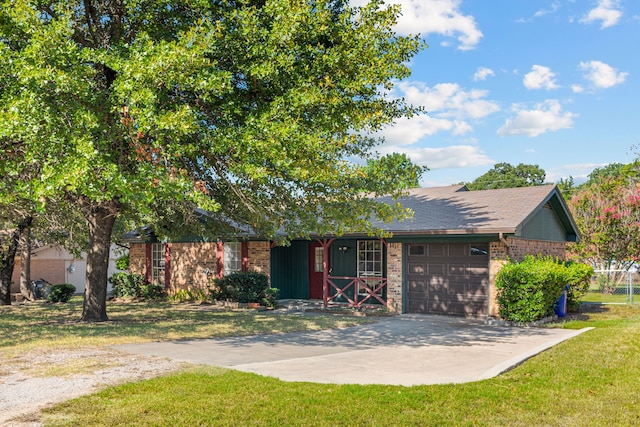 view of front of home with a front lawn and a garage