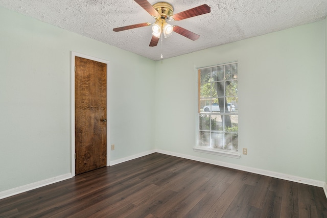 spare room featuring ceiling fan, a textured ceiling, and dark hardwood / wood-style floors