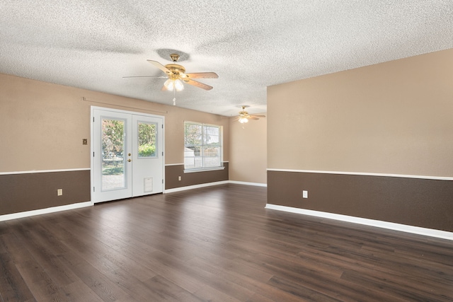 empty room featuring a textured ceiling, ceiling fan, and dark hardwood / wood-style flooring