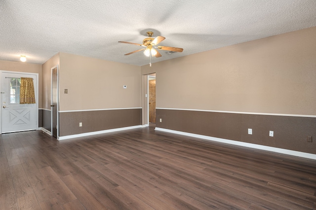 unfurnished room with dark wood-type flooring, a textured ceiling, and ceiling fan