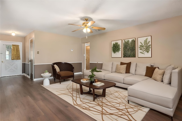 living room with wood-type flooring and ceiling fan