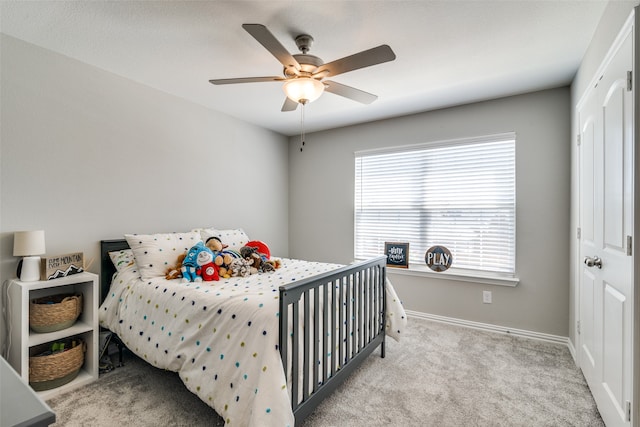 bedroom featuring light carpet and ceiling fan