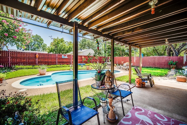 view of swimming pool featuring a patio area