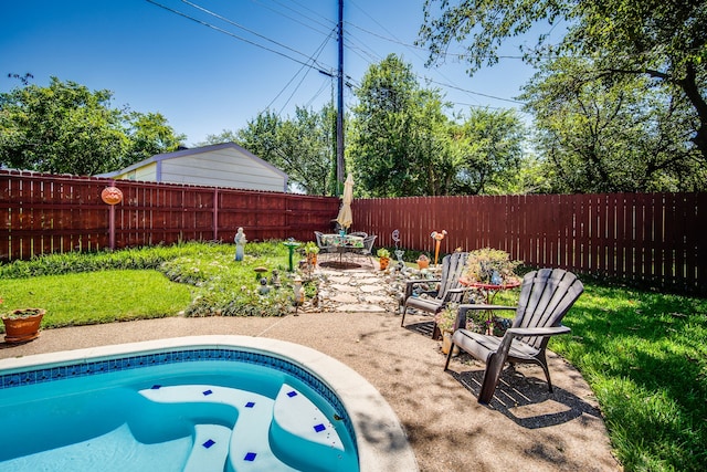 view of swimming pool with a patio area