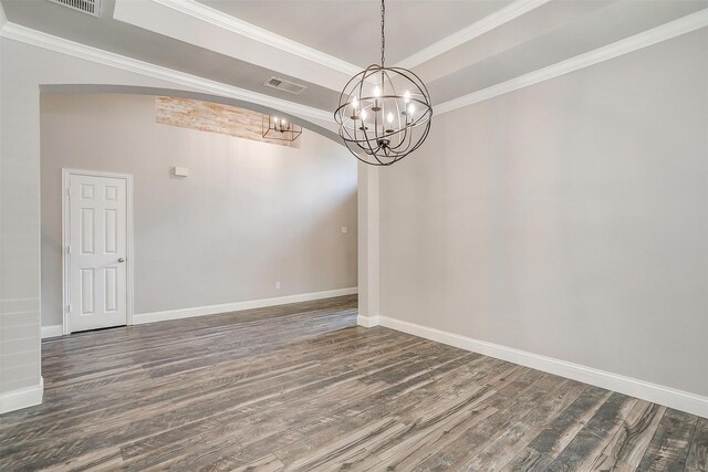 unfurnished room featuring crown molding, a notable chandelier, and dark hardwood / wood-style flooring