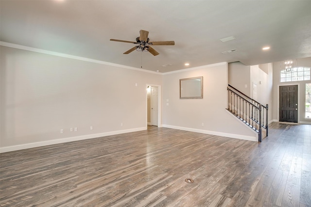 unfurnished room featuring ceiling fan with notable chandelier, hardwood / wood-style flooring, and ornamental molding