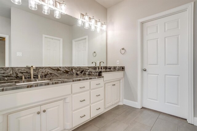 bathroom with tile patterned floors and vanity