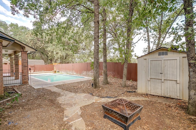 view of swimming pool with a storage shed