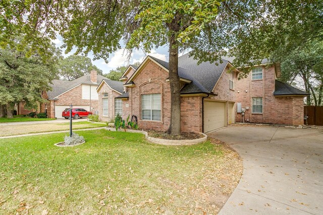 view of front of property featuring a garage and a front yard