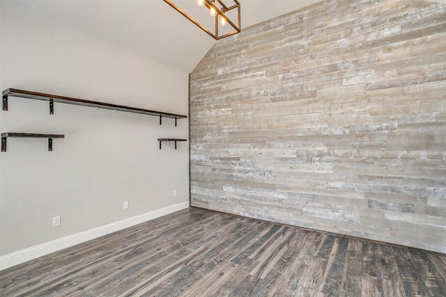 unfurnished room featuring high vaulted ceiling and hardwood / wood-style floors