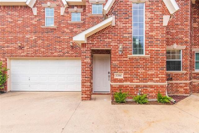 view of exterior entry featuring a garage