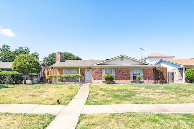 ranch-style home with a front lawn