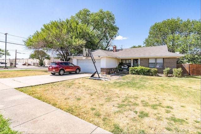 single story home featuring a front lawn and a garage