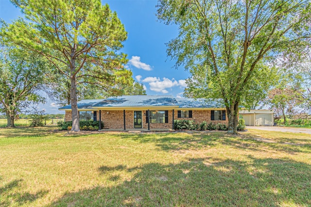 ranch-style home with a front lawn