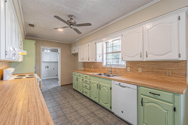 kitchen with white cabinetry, sink, backsplash, crown molding, and white appliances