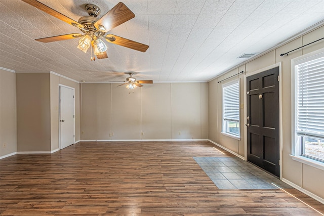 entryway featuring crown molding, hardwood / wood-style floors, and ceiling fan