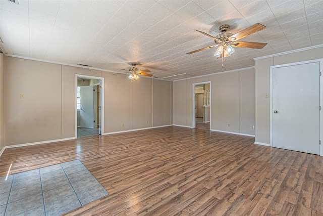 unfurnished room featuring ceiling fan, ornamental molding, and hardwood / wood-style floors