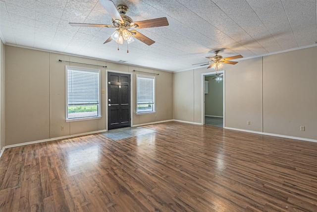 interior space featuring crown molding, dark hardwood / wood-style floors, and ceiling fan