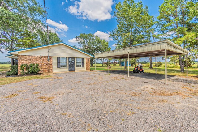 exterior space with a carport