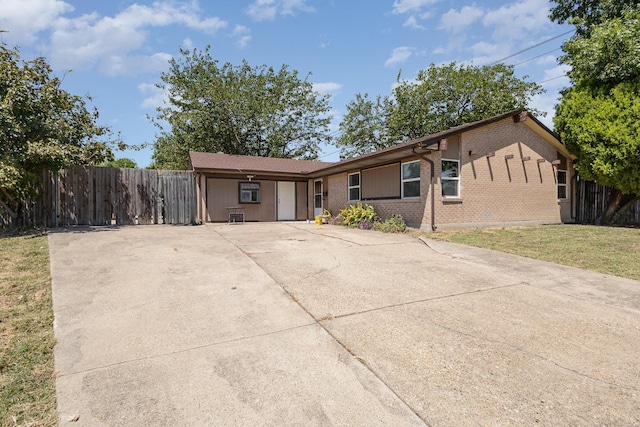 ranch-style home featuring a front yard