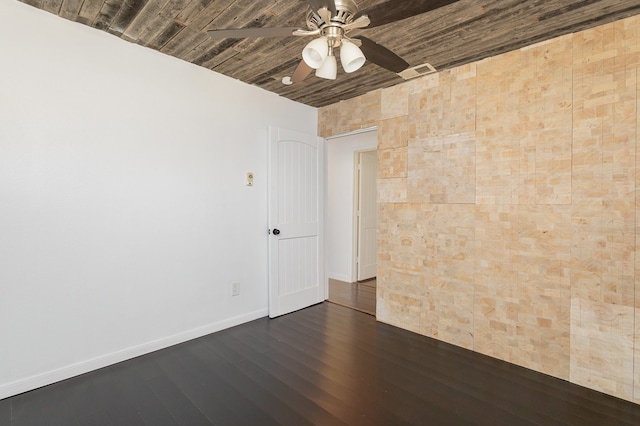 spare room featuring dark hardwood / wood-style floors and ceiling fan