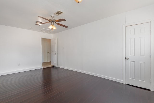 spare room with ceiling fan and dark hardwood / wood-style flooring