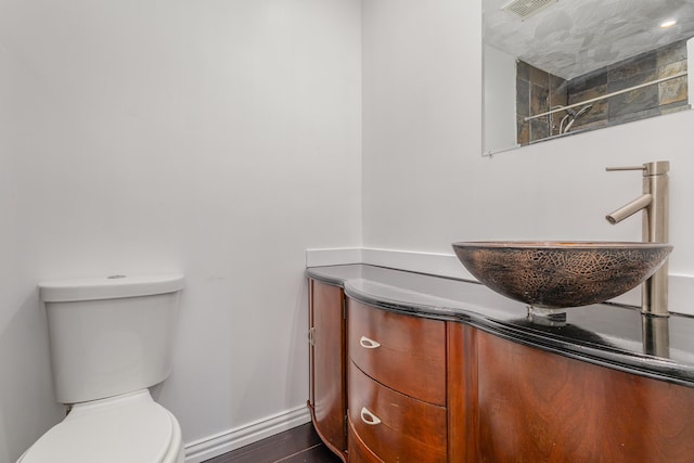 bathroom with vanity and toilet